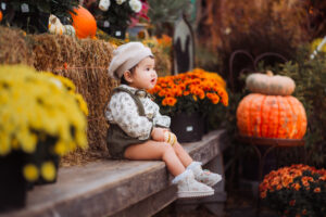 Child sitting on bench with mums.